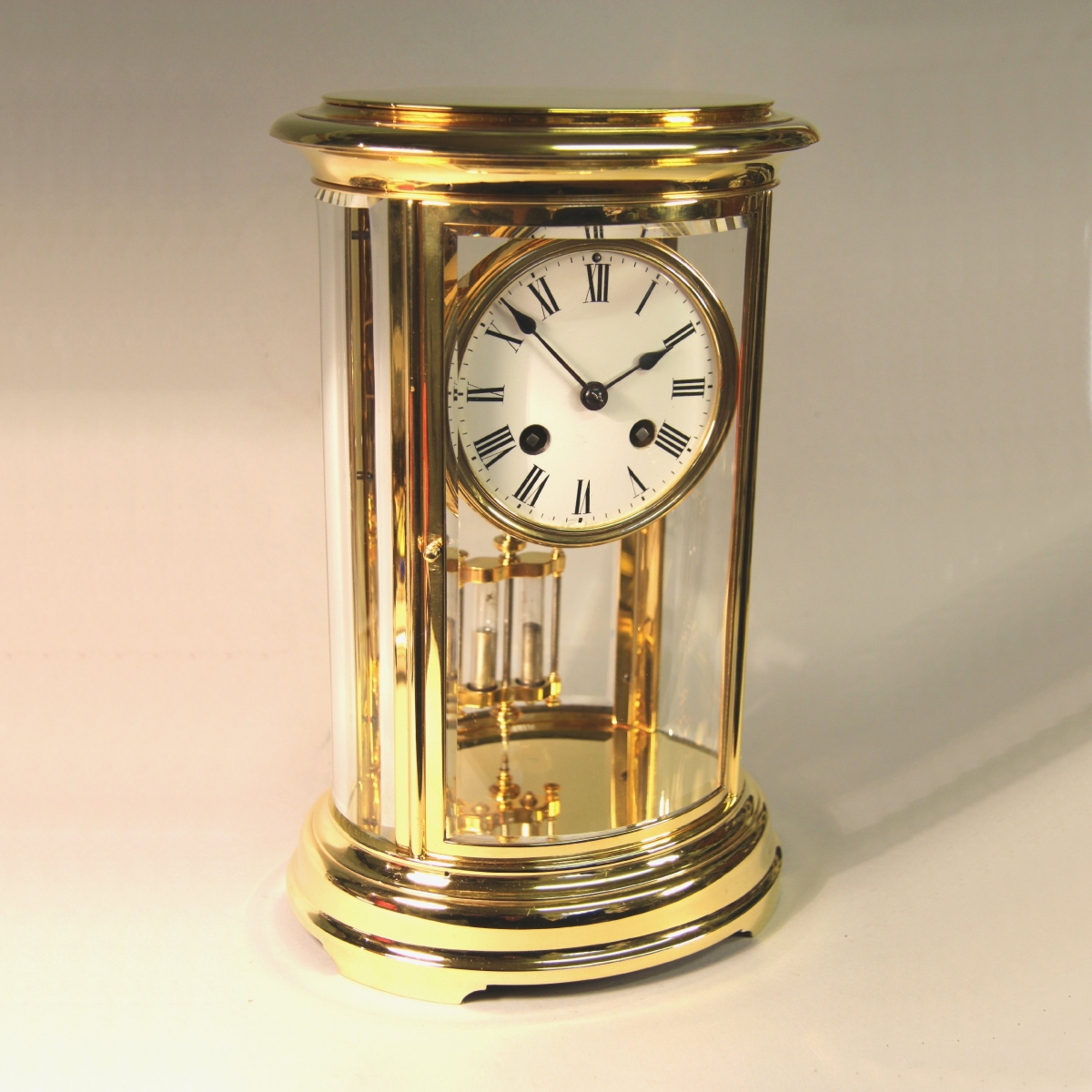 French oval four glass gilded mantel clock with mercury pendulum for