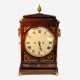 A good Regency, gadrooned chamfer top bracket clock in an elaborate mahogany case. Circa 1815.