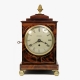 A small mahogany, late Georgian, chamfer-top table clock with a fusee timepiece movement. Circa 1835