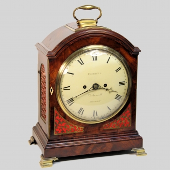 Break-arch mahogany table clock with a full, opening door by William Dorrell, Clerkenwell, London. C