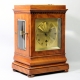 English 5 glass, satinwood library clock with a chain fusee movement and engine turned gilded dial. 