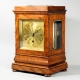 English 5 glass, satinwood library clock with a chain fusee movement and engine turned gilded dial. 