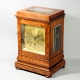 English 5 glass, satinwood library clock with a chain fusee movement and engine turned gilded dial. 
