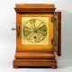 English 5 glass, satinwood library clock with a chain fusee movement and engine turned gilded dial. 