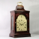 Georgian bracket clock in a mahogany bell top case. Made by Watson, London. Circa 1790.