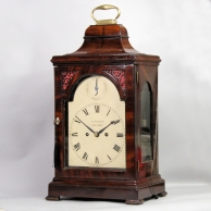 Georgian bracket clock in a mahogany bell top case. Made by Watson, London. Circa 1790.