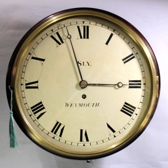 Early wooden dial English dial clock.