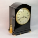 A good, small, Regency table clock in an ebony veneered case. By Louis Recordon, circa 1820.