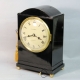 A good, small, Regency table clock in an ebony veneered case. By Louis Recordon, circa 1820.