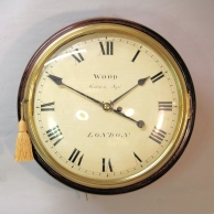 Early English fusee dial clock with a wooden convex dial and sheraton style bezel. Circa 1820.