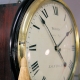 Early English fusee dial clock with a wooden convex dial and sheraton style bezel. Circa 1820.