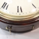 Early English fusee dial clock with a wooden convex dial and sheraton style bezel. Circa 1820.