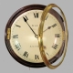 Early English fusee dial clock with a wooden convex dial and sheraton style bezel. Circa 1820.