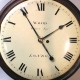 Early English fusee dial clock with a wooden convex dial and sheraton style bezel. Circa 1820.