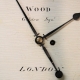 Early English fusee dial clock with a wooden convex dial and sheraton style bezel. Circa 1820.