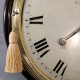 Early English fusee dial clock with a wooden convex dial and sheraton style bezel. Circa 1820.