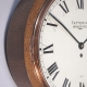 Oak cased wall 'dial' clock with lever escapement, by Elliott. A rare style. Circa 20th ce